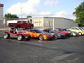 What is that red thing parked with the Corvettes